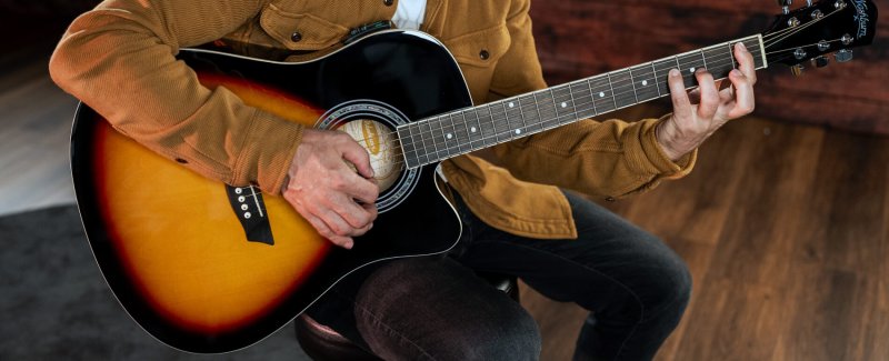 Player with a Washburn WA90CE acoustic-electric guitar, stock photo
